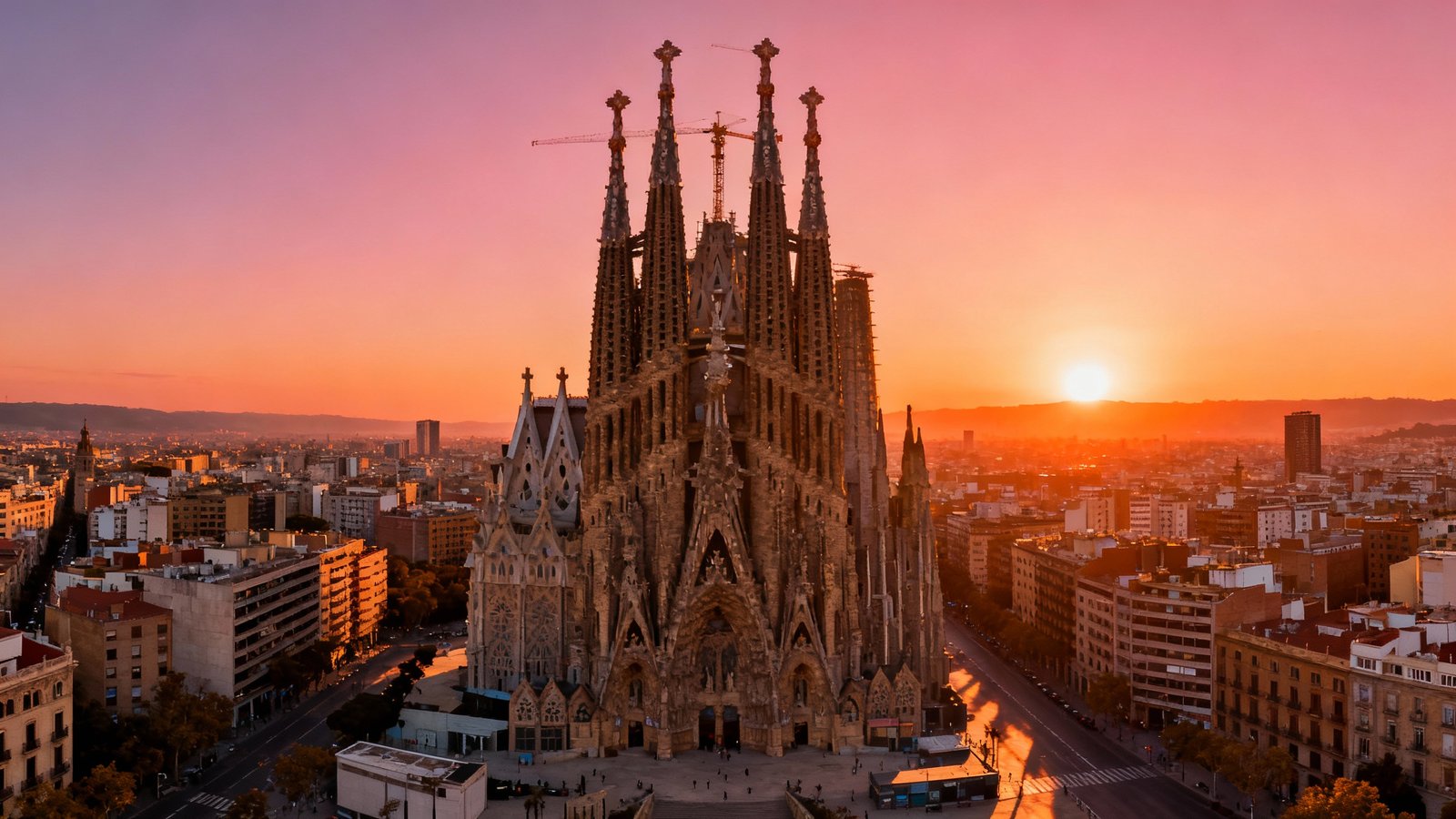 Panoramic view of Barcelona's skyline with Sagrada Familia at sunrise