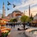 Ultra-realistic image of the bustling Sultanahmet Square, with Hagia Sophia and Blue Mosque in the background, on a bright spring morning.