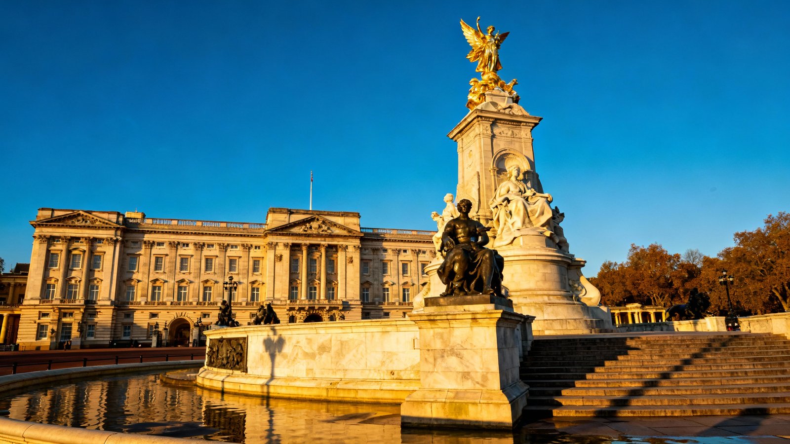 A stunning, ultra-realistic shot of Buckingham Palace with the Victoria Memorial in the foreground, under a clear blue sky
