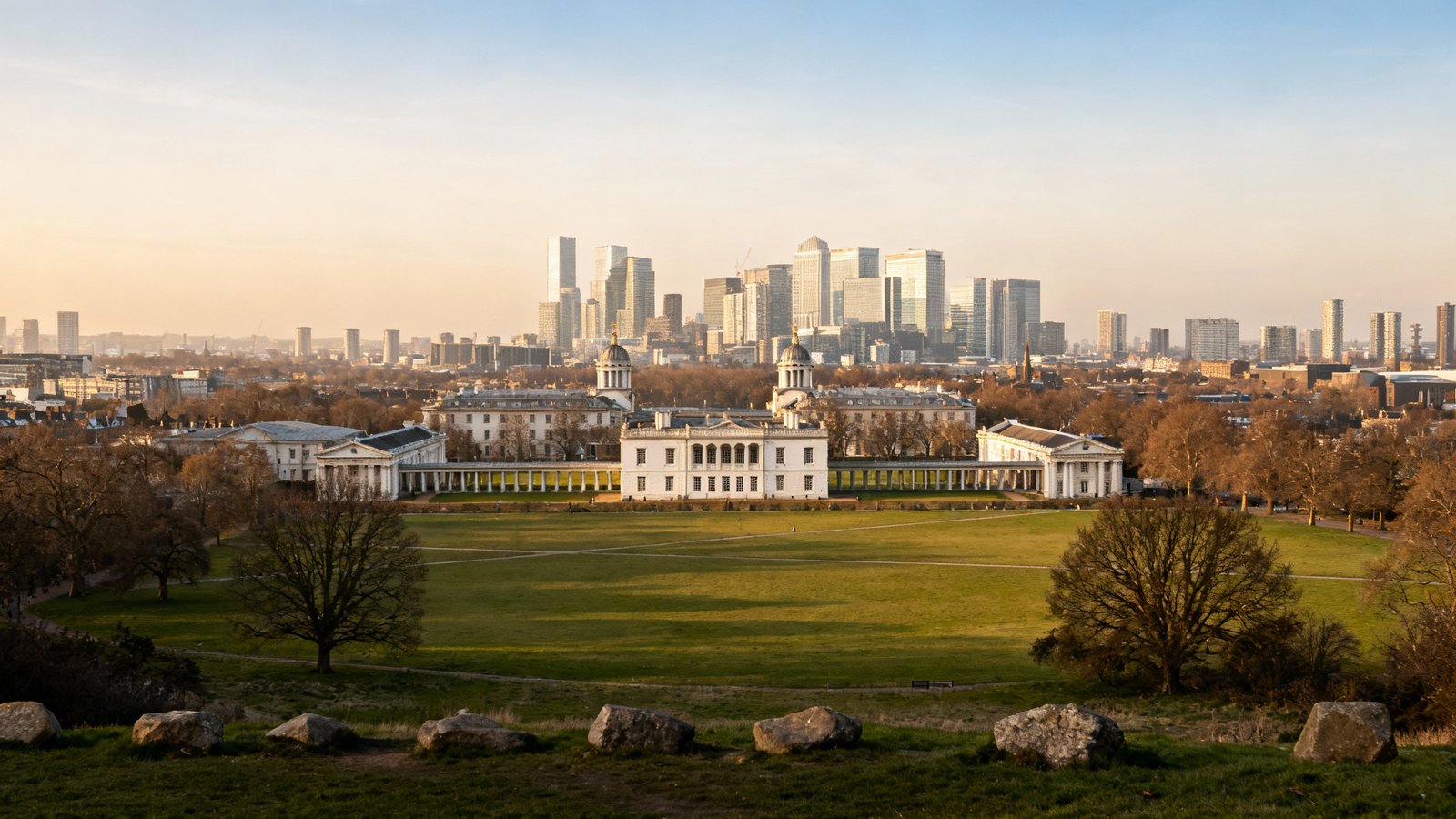 Sweeping view from Greenwich Park, showing the Queen's House and the modern skyscrapers of Canary Wharf in the distance
