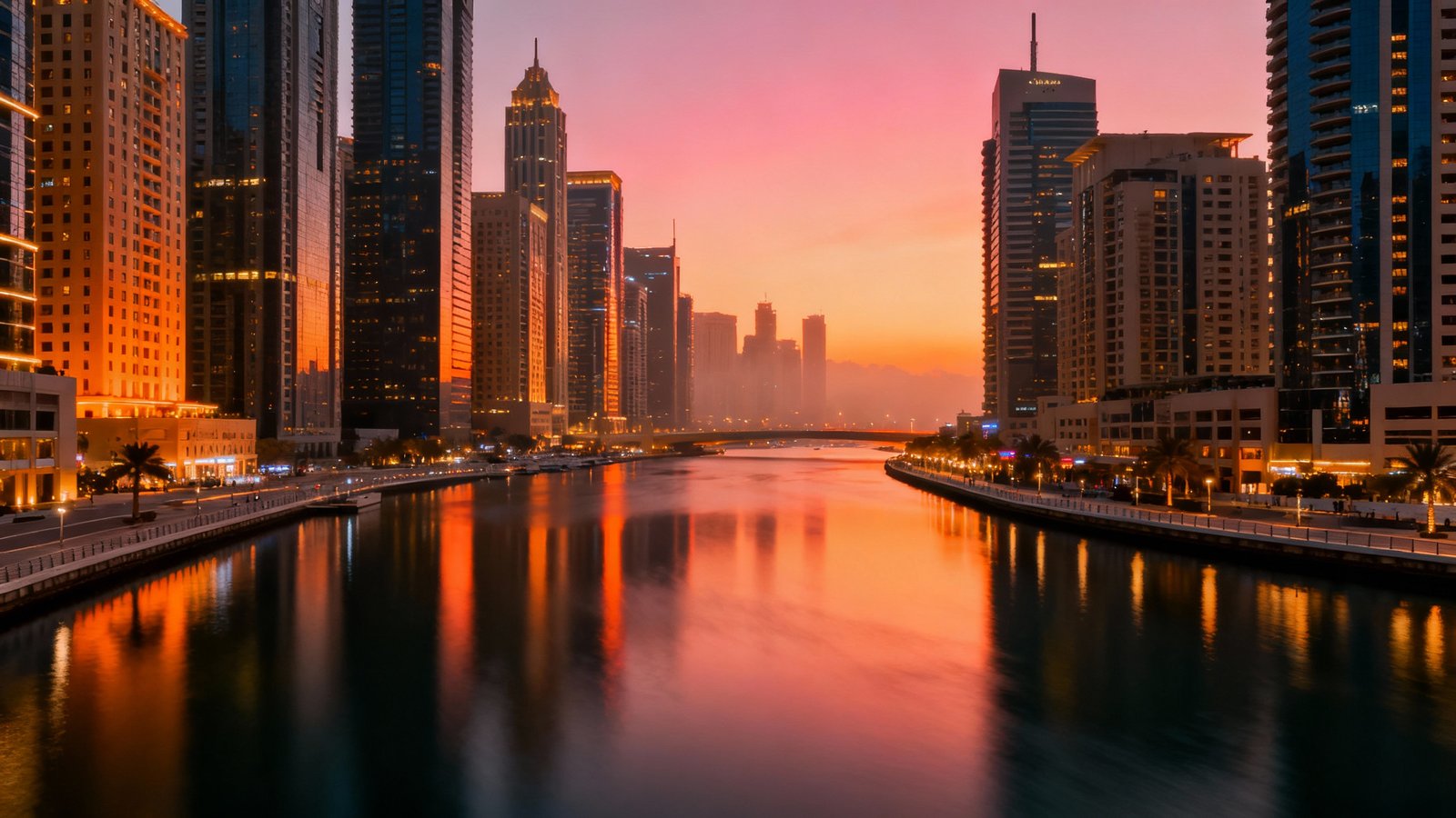Cinematic wide-angle shot of the Dubai Marina skyline at sunset, with glowing skyscrapers reflecting in the calm waters of the canal